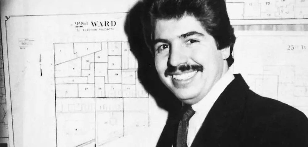 Rudy Lozano in front of a 22nd Ward precinct map